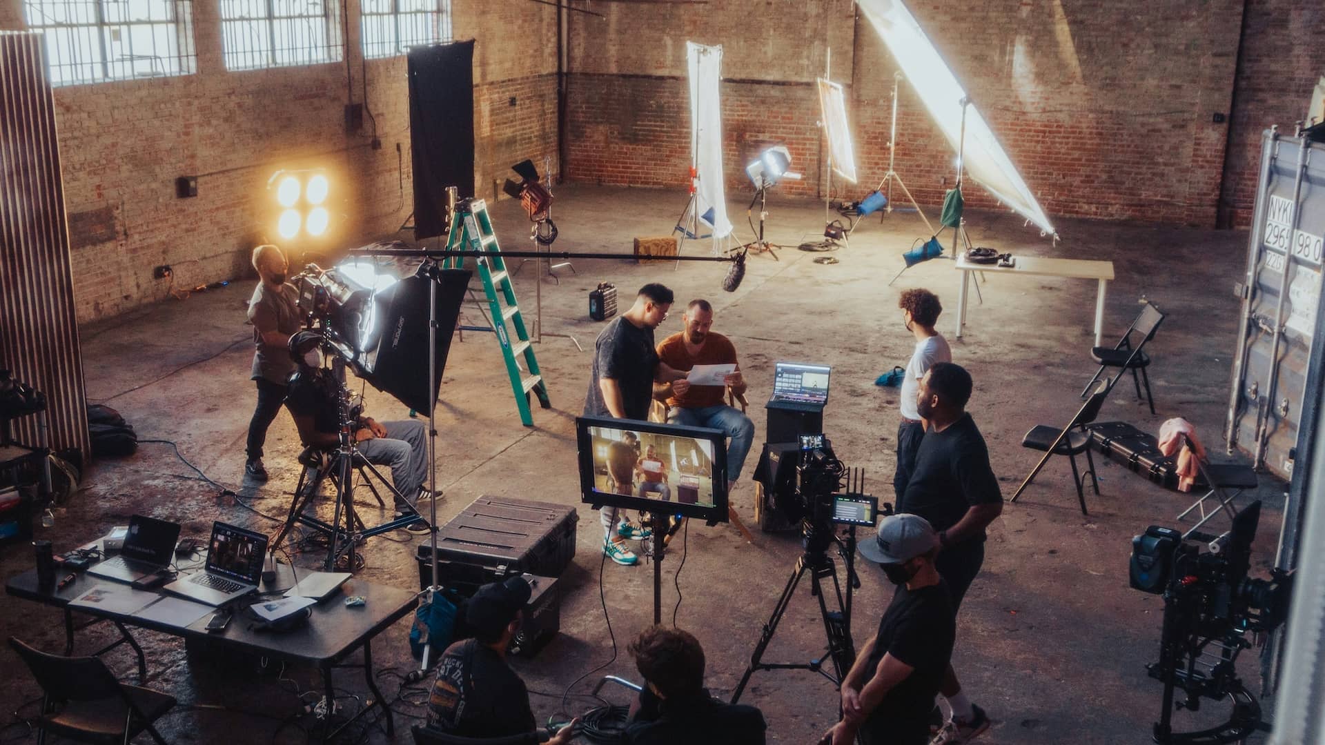 Film Production Cast and Crew Movie Set with Actors and Director StudioBinder